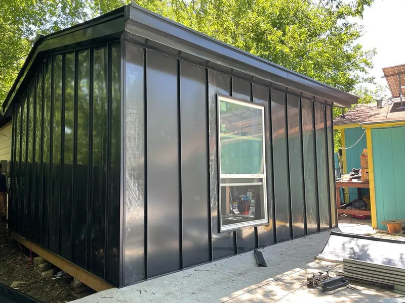 Black standing seam metal wall panels for Roof Inspection in West New York